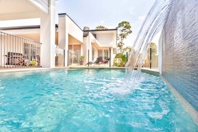 Swimming pool in house front side near garden
