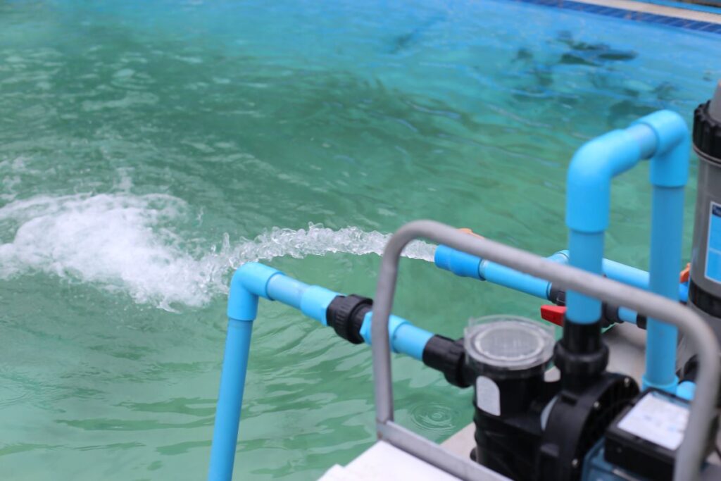 The water pump is pumping water into the pool