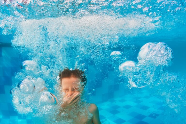 Happy family have fun in swimming pool