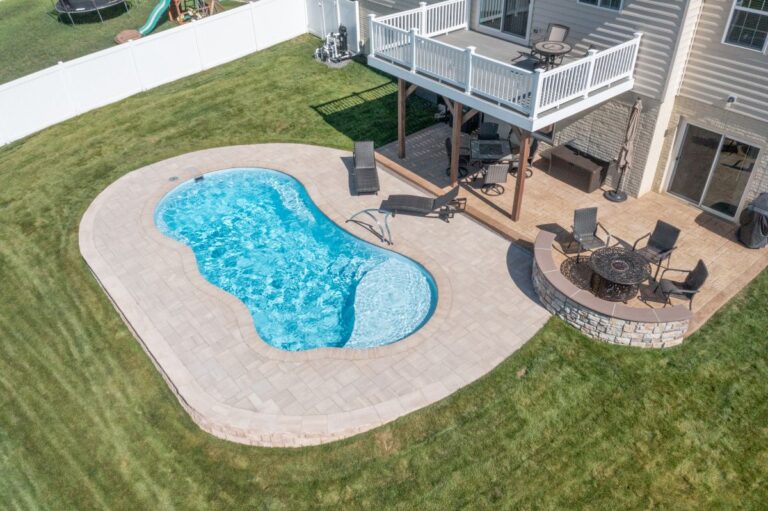 River Pools I30 Caribbean Sparkle with bubblers, concrete paver patio and coping