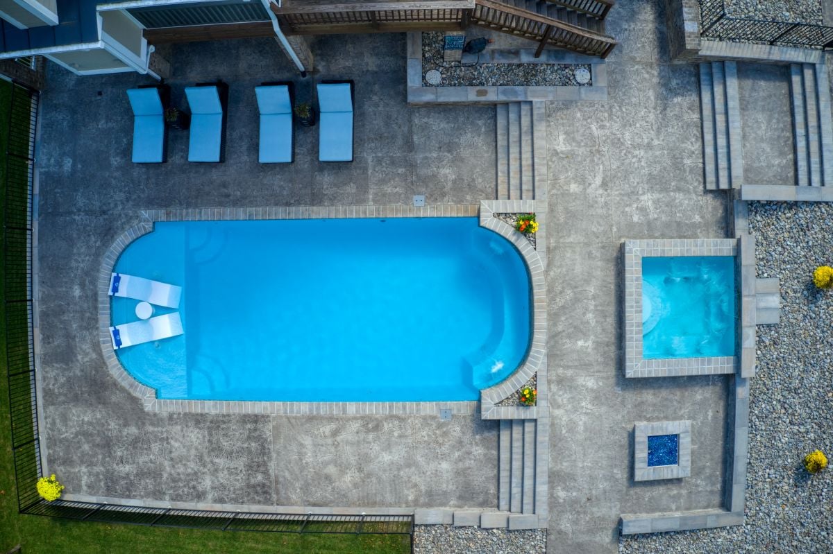 aerial view of a pool and hot tub